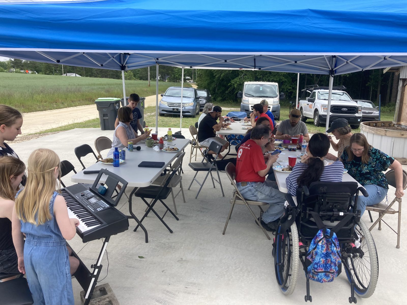Worship and a meal under the tent