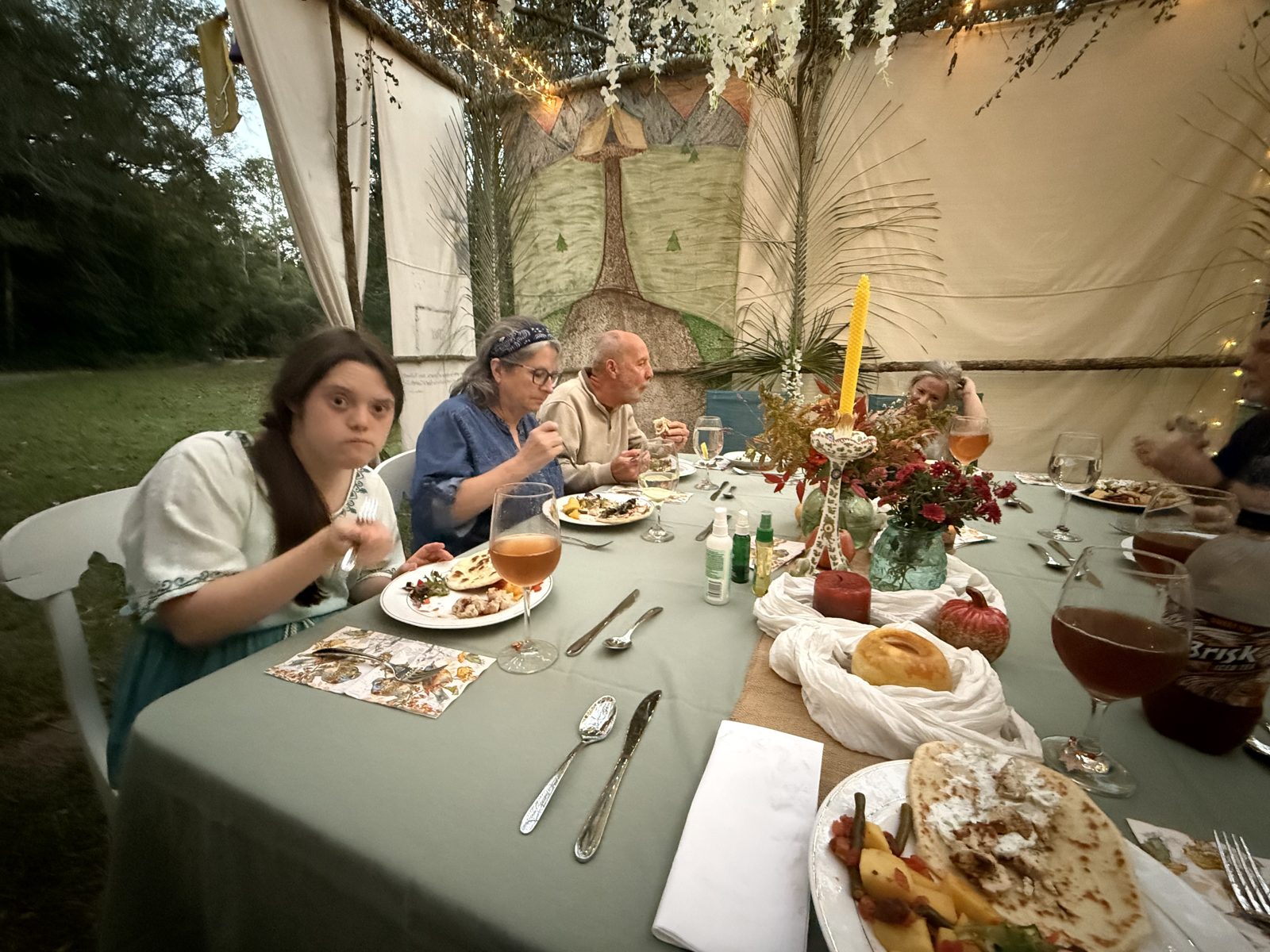 Sharing a meal in the sukkah