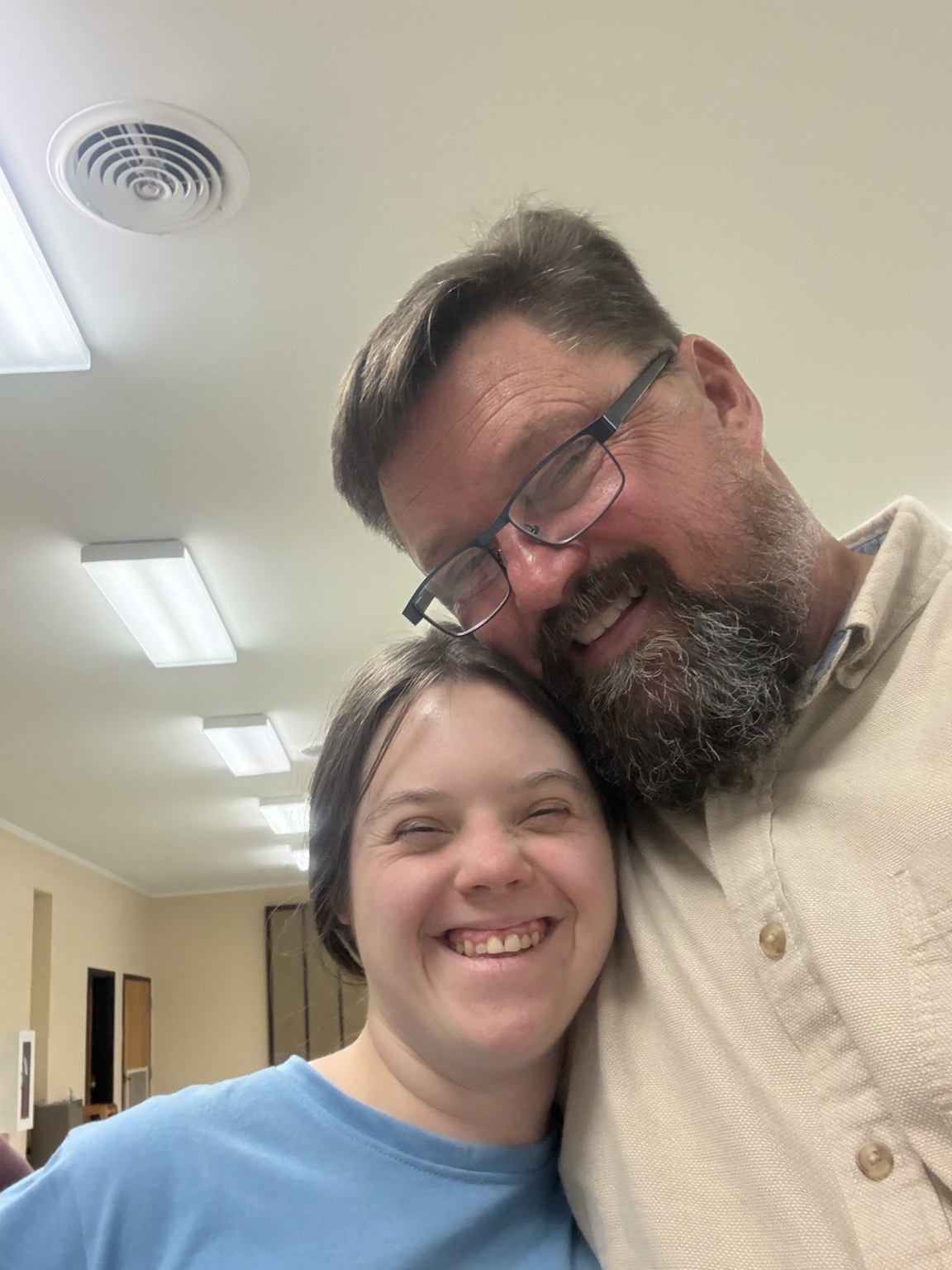 A smiling pair together indoors