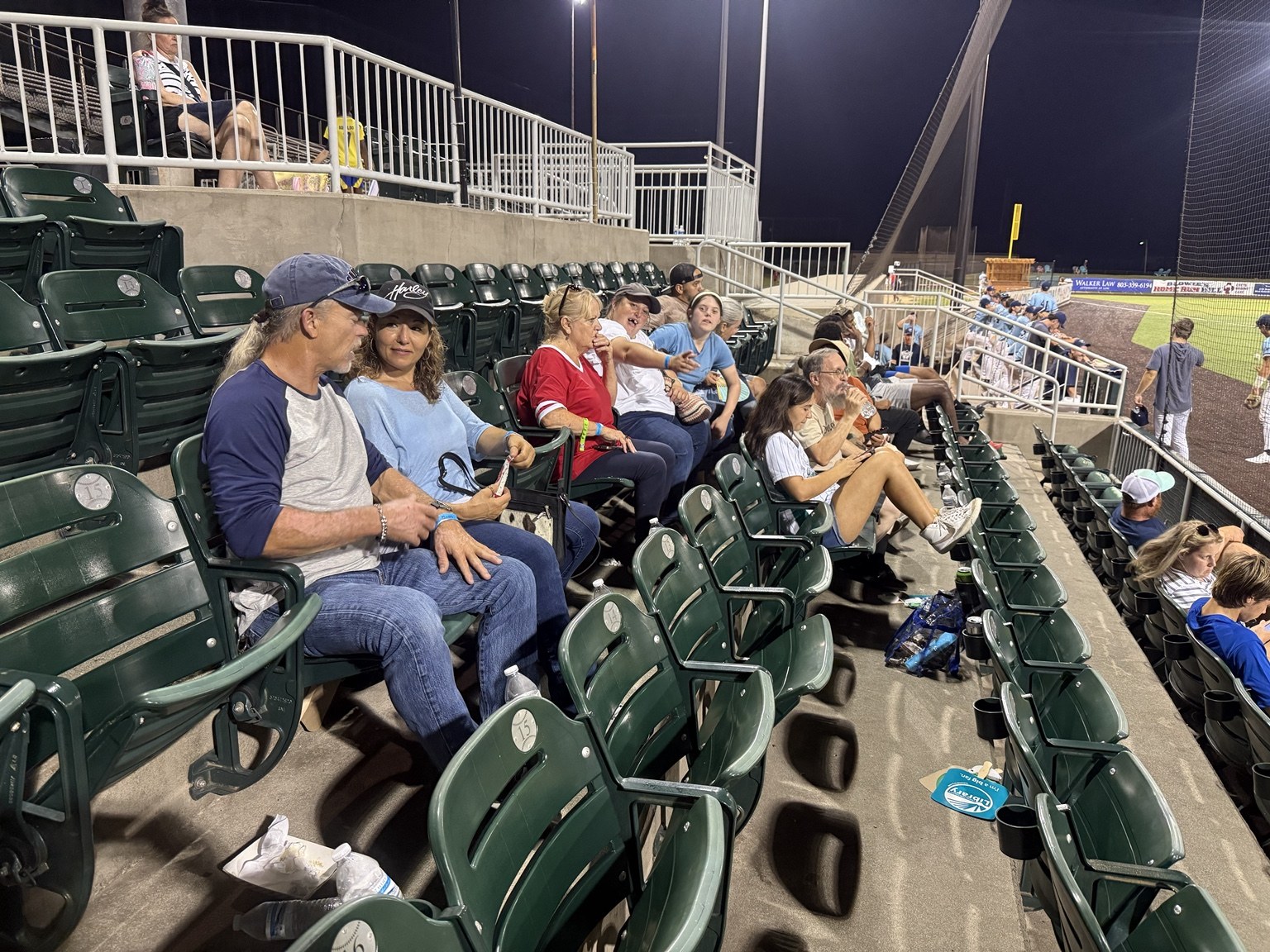 Friends enjoying an evening at the ballpark