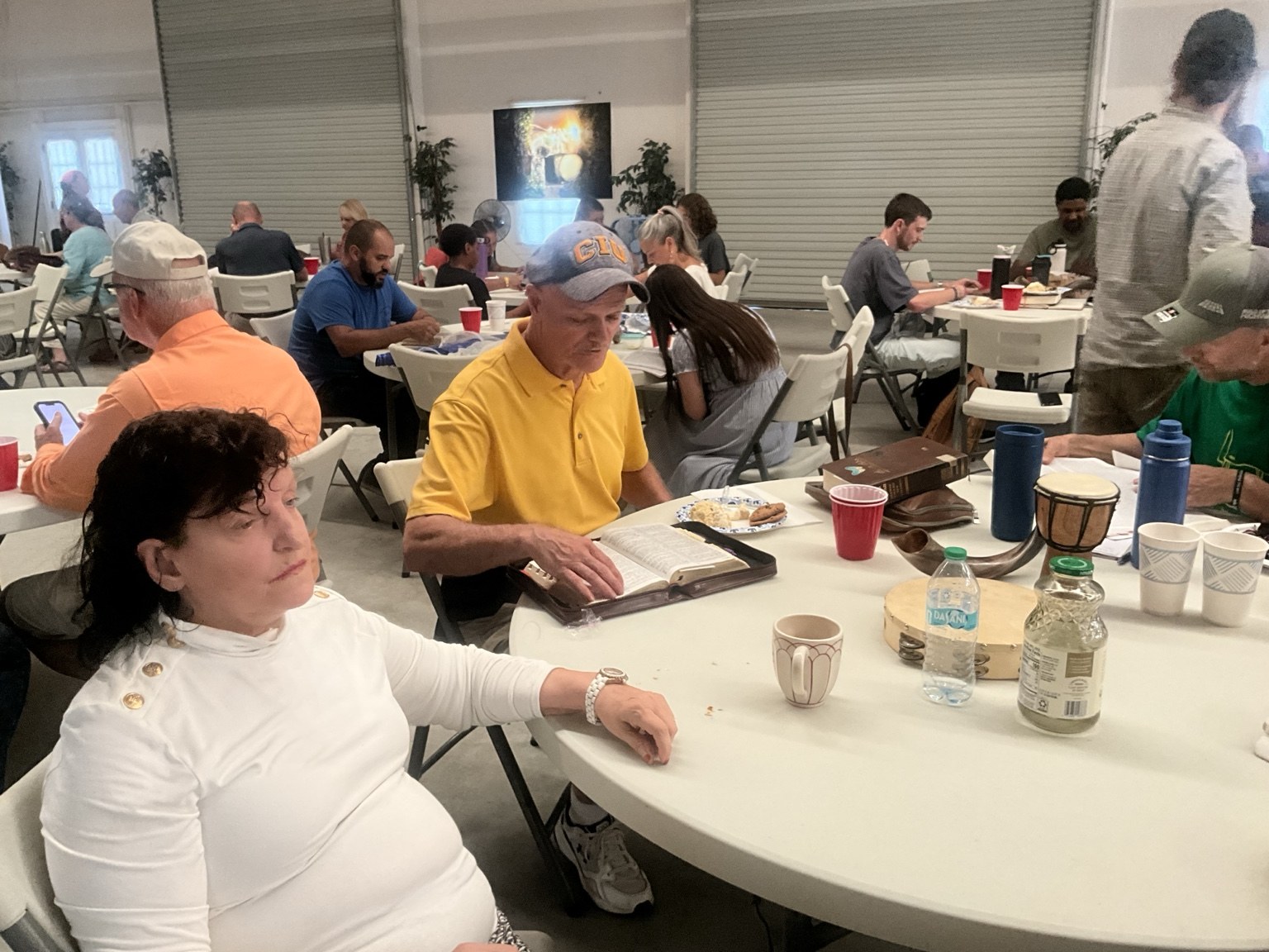 Sharing a meal around the fellowship tables